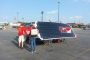 Members of Team PrISUm recharge Phaeton's batteries for the second day of the American Solar Challenge. Photo provided by Team PrISUm.