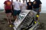 Members of Cyclone Space Mining, left to right, Katie Goebel, John Heinig, Brian Jend, Nathan Beougher, David Peiffer, Phil Molnar, Alex Grant, and Faculty Adviser Jim Heise demonstrate their robotic miner on Hilo Bay Beach in Hawaii. Photo by Pacific International Space Center for Exploration Systems.