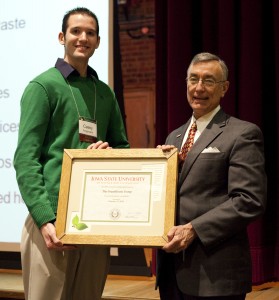 Fangmann accepting an award for the GreenHouse Group.