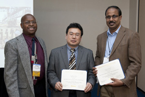 TRB Soil Mechanics Section Chair Njoroge Wainaina (left) recognizes former civil engineering graduate student Kam Ng (middle) and Professor Sri Sritharan (right) for Soil Mechanics Section Best Paper Award. Dordt College student Danielle DeBoer and Iowa State Department of Transportation engineer Kenneth Dunker also contributed to the winning paper (not pictured).