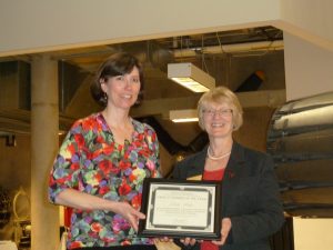College of Engineering Dean Rajala (right) presents the College of Engineering student body award for Faculty Member of the Year to IMSE Senior Lecturer Leslie Potter.