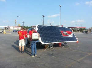 Members of Team PrISUm recharge Phaeton's batteries for the second day of the American Solar Challenge. Photo provided by Team PrISUm. 