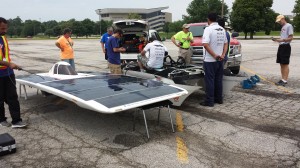 At the Ames checkpoint, solar car team Qazvin Islamic Azad: QIAU HAVIN repairs the brake system on their solar car. Mohammadreza Sadeghein, a member of the car's chase and body team, said the American Solar Challenge is the first race that the Iranian team has competed in the United States.