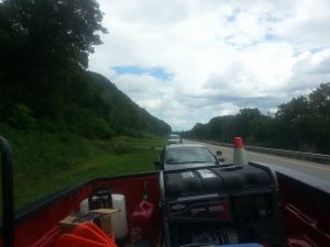 From the view of Team PrISUm's lead vehicle, Wisconsin police run verify the solar car's licensing and registration. Provided by Team PrISUm.