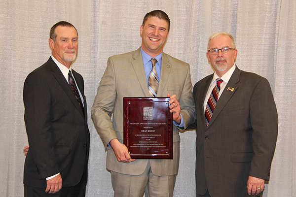 The International Code Council awards Brian Bishop (pictured center, BSConE'04) the Gerald H. Jones Code Official of the Year Award. Also pictured are ICC Board of Directors Member Greg Wheeler (left) and ICC Board of Directors President Stephen D. Jones (right).
