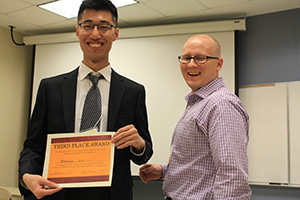 Zhengyu Liu (left) places third in the poster competition.