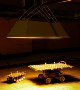 Solar-powered robots and the indoor solar simulator Dai has created.