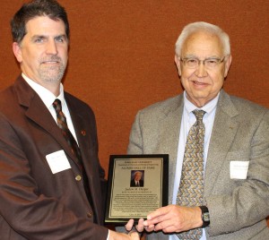 Dr. Andy Hillier, Chair of the Department of Chemical and Biological Engineering (left), presents Dr. Judson M. Harper with his Hall of Fame plaque