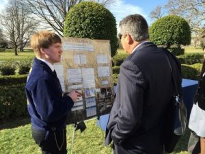 Eric Koehlmoos of South O'Brien High School in northwest Iowa explains his "Grass to Gas" research project in the Rose Garden during the 2015 White House Science Fair. (Photo courtesy of Eric Koehlmoos.)