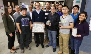 Iowa State researchers studying snow- and ice-free pavements for airport runways include, left to right: Yelda Turkan, Sunghwan Kim, Weibin Shen, Kasthurirangan Gopalakrishnan, Halil Ceylan, Ali Arabzadeh, Alireza Sassani, Sharif Gushgari, Hesham Abdualla, Shuo Yang, Yu-An Chen and Pritha Anand. Photo by Christopher Gannon.