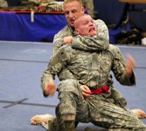 The other side of Knox's college years: Here he participates in the Army's Best Warrior competition. That's him dishing out the choke hold.