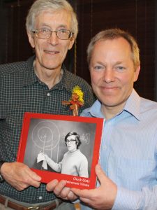 ISU Chemical Engineering alum John Kaiser (right) presents Glatz with a book he produced commemorating Glatz' 40 years at Iowa State.
