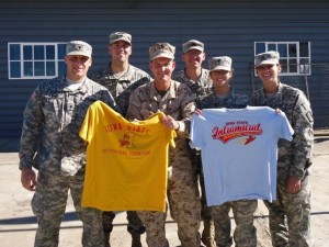 Knox (front row, left) and his Ames-based Army unit show their Cyclone pride while in the Middle East.