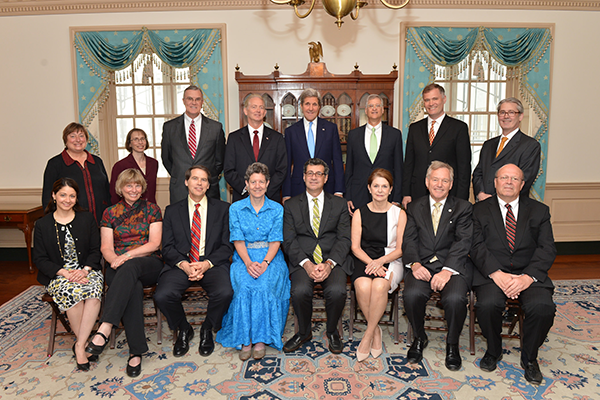 Iowa State University Environmental Engineering Professor Jim Alleman (back row, third from left) poses with U.S. dignitaries and other 2014-2015 Jefferson Science Fellows at the Harry S. Truman U.S. Department of State Building May 20, 2015, in Washington, D.C. U.S. dignitaries pictured include U.S. Secretary of State John Kerry (back row middle, wearing blue tie);  Catherine Novelli, Under Secretary for Economic Growth, Energy and the Environment at the U.S. Department of State (back row, standing far left); Judith Garber, Acting Assistant Secretary for the Bureau of Oceans and International Environmental and Scientific Affairs (back row, standing second from left); Frances Colon, Acting Science and Technology Advisor at the U.S. Department of State (front row, sitting far left); and Jerry O'Brien, Assistant Director of the Global Development Lab at the U.S. Agency for International Development (back row, standing far right).