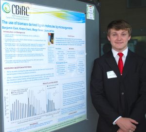 Boone High School student Ben Clark shows off his research project poster from his time in this summer's YES program