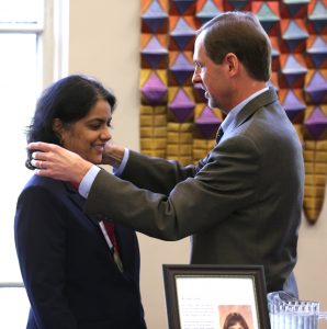 Surya Mallapragada is presented with the medallion for Carol's Chair by Iowa State University Senior Vice President and Provost Jonathan A. Wickert. (Photo by Christopher Gannon/Iowa State University)