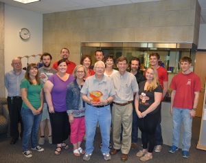 McGee (front, center) celebrates with students, colleagues and friends at his 90th birthday celebration