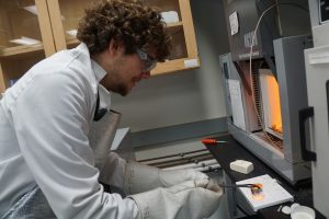 German exchange student Johannes Betz conducts research in the glass and optical materials research lab