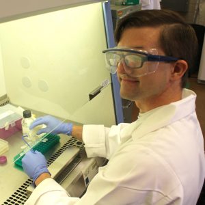 Adam Carr, a student at Brigham Young University, works on his BioMaP REU project in Sweeney Hall.