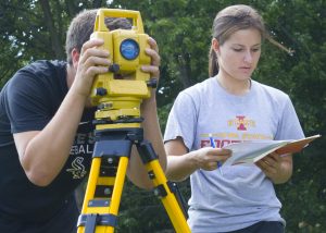 Students Robert Thomm (left) and Ashley Price work in teams during a civil engineering (CE) 111: Fundamentals of Surveying I course (Photo by Kate Tindall)