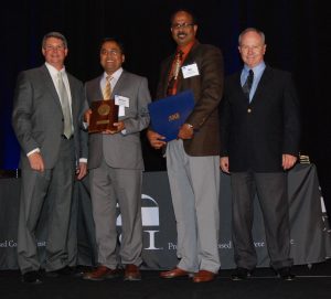 Ataur Rahman (PhDCE2008, second from left) and Sri Sritharan (third from left) accept the T.Y. Lin Award (Photo courtesy PCI)