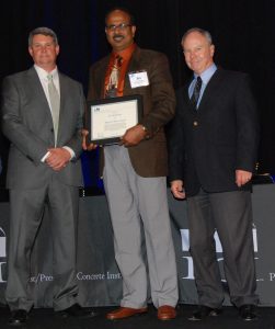 Sri Sritharan (middle) accepts the Martin P. Korn Award (Photo courtesy PCI)