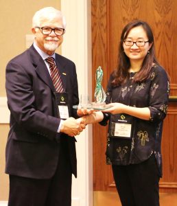 Dr. Zengyi Shao receives the Iowa Energy Center Impact Award from Dr. Mufit Akinc. He is the Interim Director of the Iowa Energy Center, a courtesy professor in the Department of Chemical and Biological Engineering and a professor in the Department of Materials Science and Engineering at Iowa State.