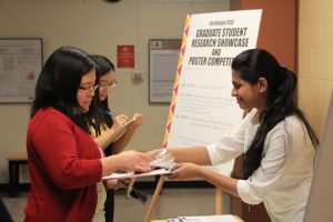 CCEE Assistant Professor Kaoru Ikuma (left) and student at Fifth Annual CCEE Graduate Student Research Showcase and Poster Competition