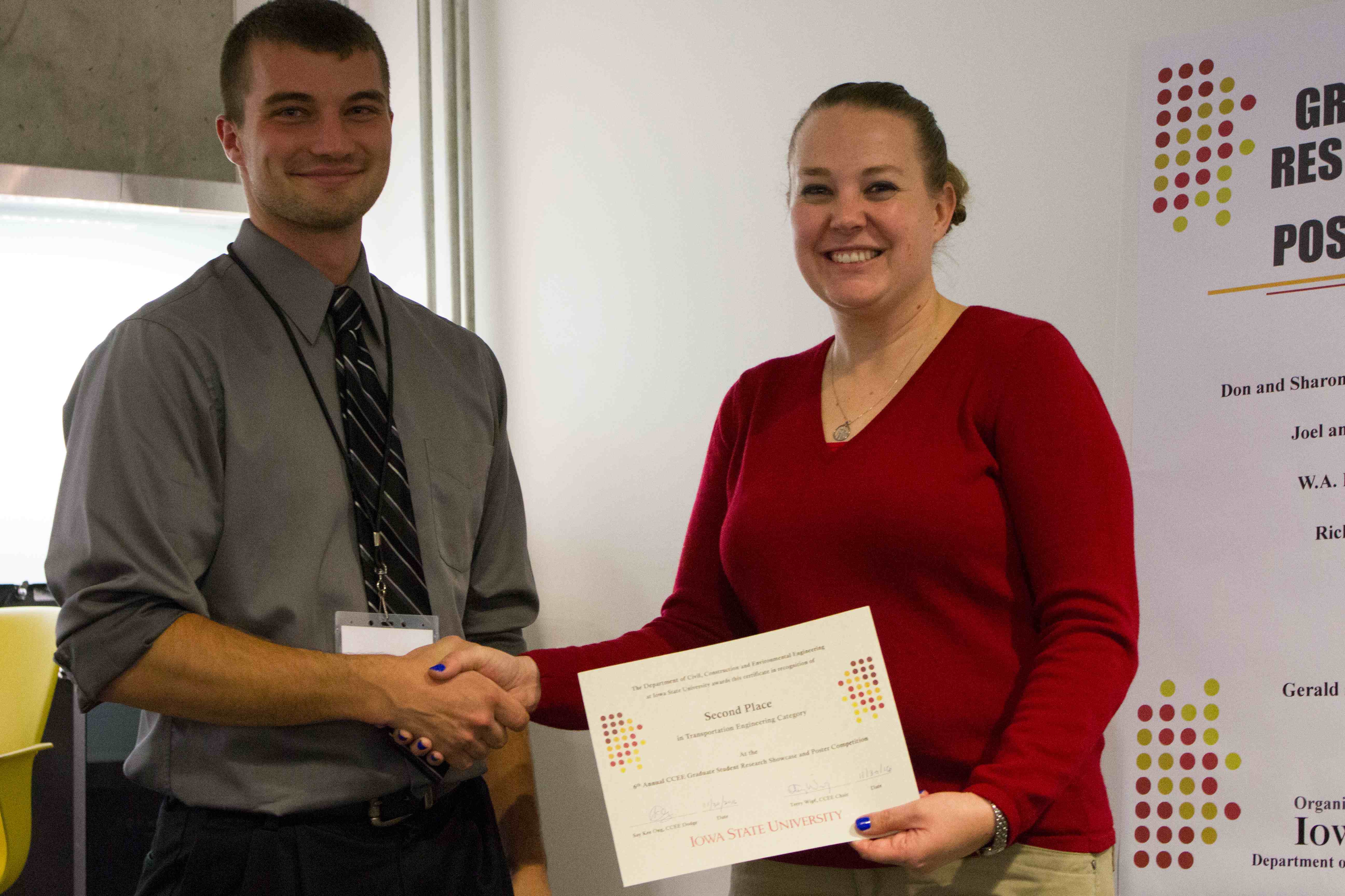 Ophoff (left) earns first place in the Exhibition Showcase category at the Sixth Annual CCEE Graduate Student Research Showcase and Poster Competition. Dr. Jennifer Shane (right) giving award. (Photo by Kate Tindall)