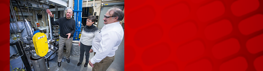 Iowa State's Robert C. Brown, left, explains new pyrolysis technology to Karen Fletcher, leader of the RAPID Institute for manufacturing; and Mark Gaalswyk, leader of Easy Energy Systems in Emmetsburg; during a recent tour of the BioCentury Research Farm.