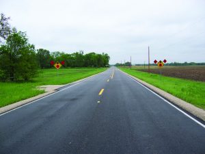 Flags placed on rural road traffic signs