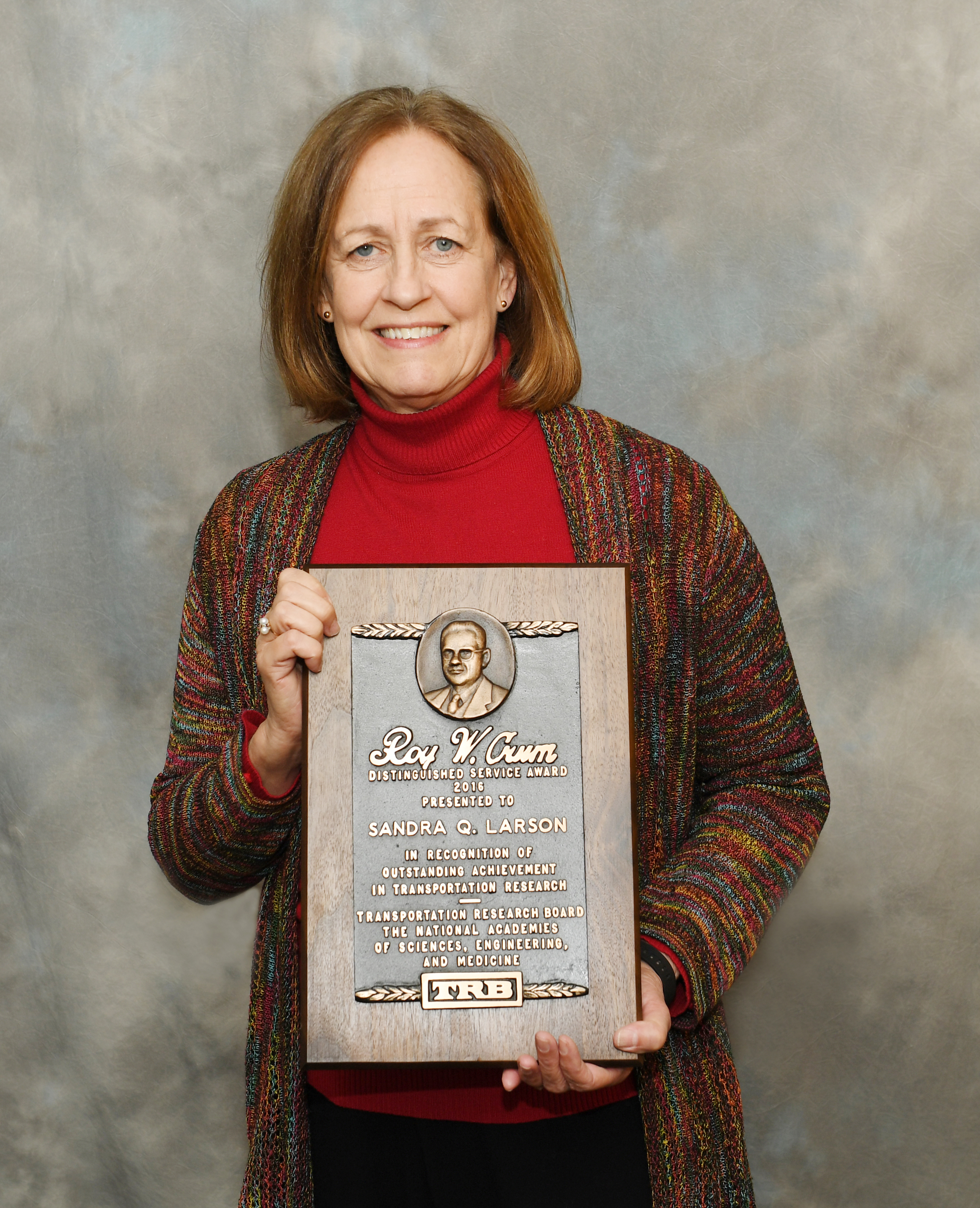 Sandra Larson with Roy W. Crum Distinguished Service Award (Credit: Iowa Department of Transportation)