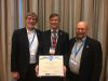 Giroux (center) accepts the Roebling Award at ASCE's Construction Research Council. ISU Construction Engineering Program Professor-in-Charge Chuck Jahren (left) and ISU Construction Engineering Professor Doug Gransberg (right) accompany him to accept the award. Photo courtesy Paul Giroux