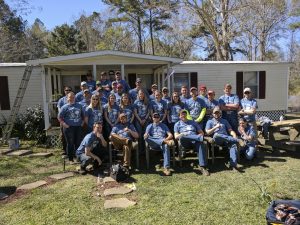 AGC members take a quick break for a photo outside one residential work site (Photo courtesy Kurtis Schreck)