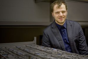 Austin Downey with a model of the sensors detailed in his paper. <i>Photo by Kate Tindall.</i>