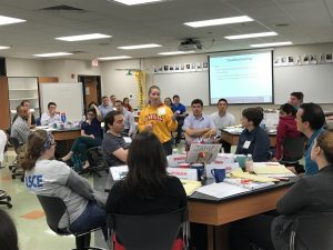 Cassandra Rutherford (center, standing) leads a workshop during ExCEEd. <i>Photo courtesy Beth Hartmann.</i>