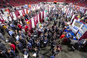 Thousands of students on the floor of Hilton Coliseum talk with company recruiters at the Fall College of Engineering Career Fair.