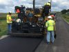 Crews lay high RAP asphalt pavement on a section of road in Crawford County, Iowa. This RAP mixture uses an innovative new rejuvenator.