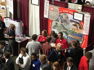 Students gather around the Army Corps of Engineers-Rock Island District Booth to talk with representatives.
