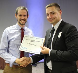 Prof. Nigel Reuel with award