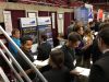 Recruiters from Mortenson talk with students and view resumes.