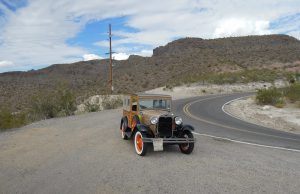 The car is stopped at the top of a summit after driving up Sitgreaves Pass in Golden Valley, Arizona. Photo provided by Christopher Gillis. 
