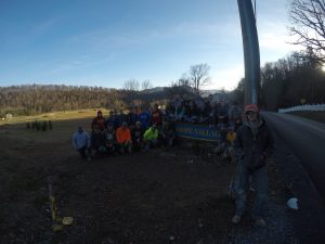 Members of AGC gather at the entrance to Hope Village in West Virginia during their fall 2017 volunteer trip. <i> Photo courtesy Nathan Pals. </i>