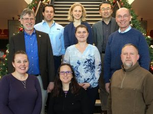 A number of construction engineering faculty gather for a group photo. Faculty members include <i>(front row, from left)</i> Jennifer Shane, Aliye Karabulut-Ilgu (civil/construction engineering faculty member), Brad Perkins. <i>(Middle row)</i> Charles Jahren, Cristina Poleacovschi, Larry Cormicle. <i>(Back row)</i> Michael Perez, Kristen Cetin, David Jeong. <i>Not pictured</i> Jenny Baker and Beth Hartmann.