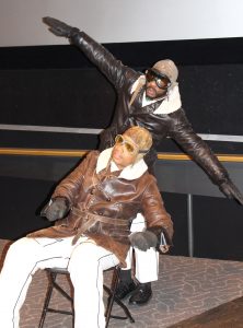 Actors miming flying plane