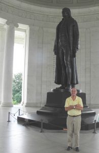 Jiles stands with a statue of Thomas Jefferson at the Jefferson Memorial in Washington D.C.