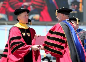 Muilenburg receiving diploma