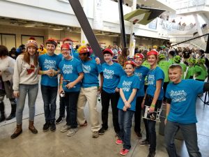 Fulcher <i>(far left)</i> volunteers and mentors students at FIRST Lego League. <i>Photo courtesy Fulcher.</i>