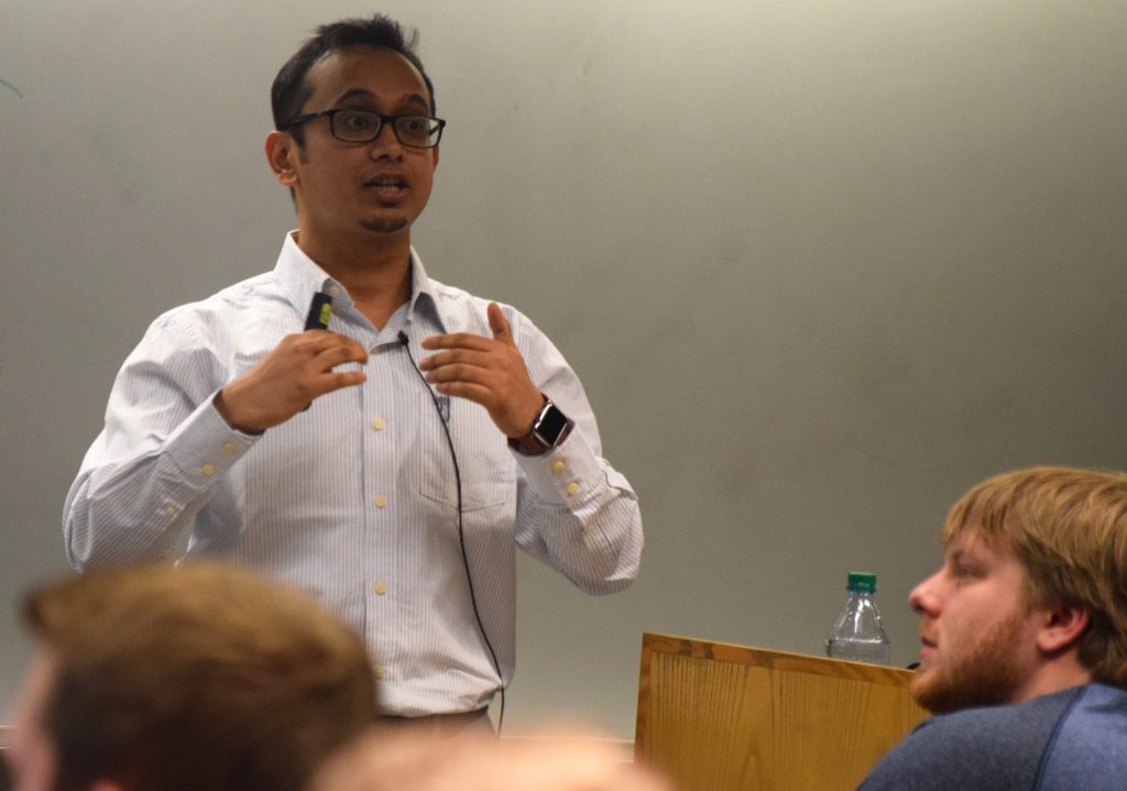 Sougata Roy stands in front of a class to give a presentation