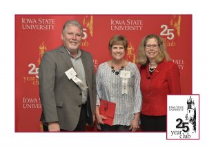 Sylvia Anderson is recognized for 35 years of service. She stands with Iowa State University President Wendy Wintersteen and ABE Department Chair, Steve Mickelson.